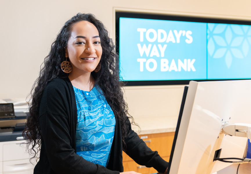 Female employee smiling in branch