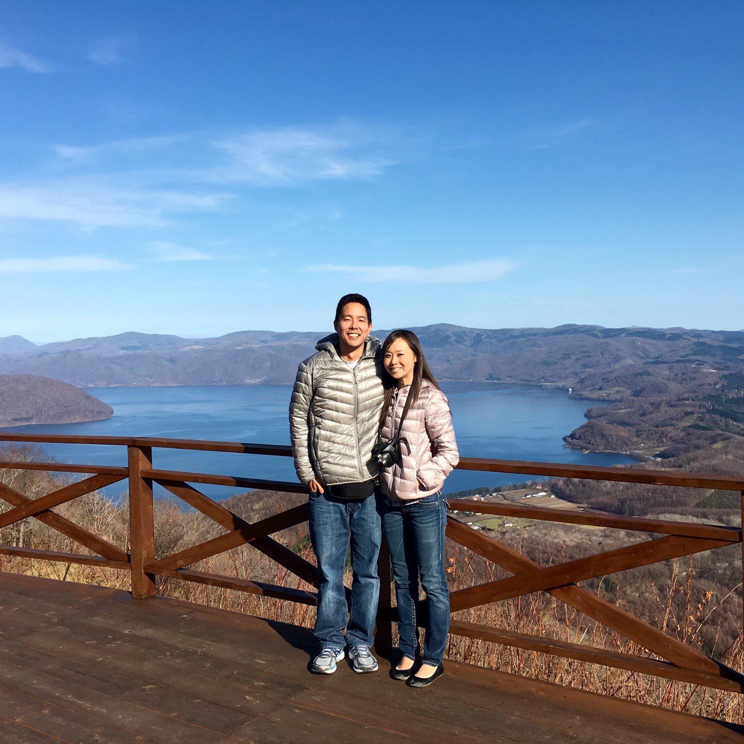 Couple standing on a bridge